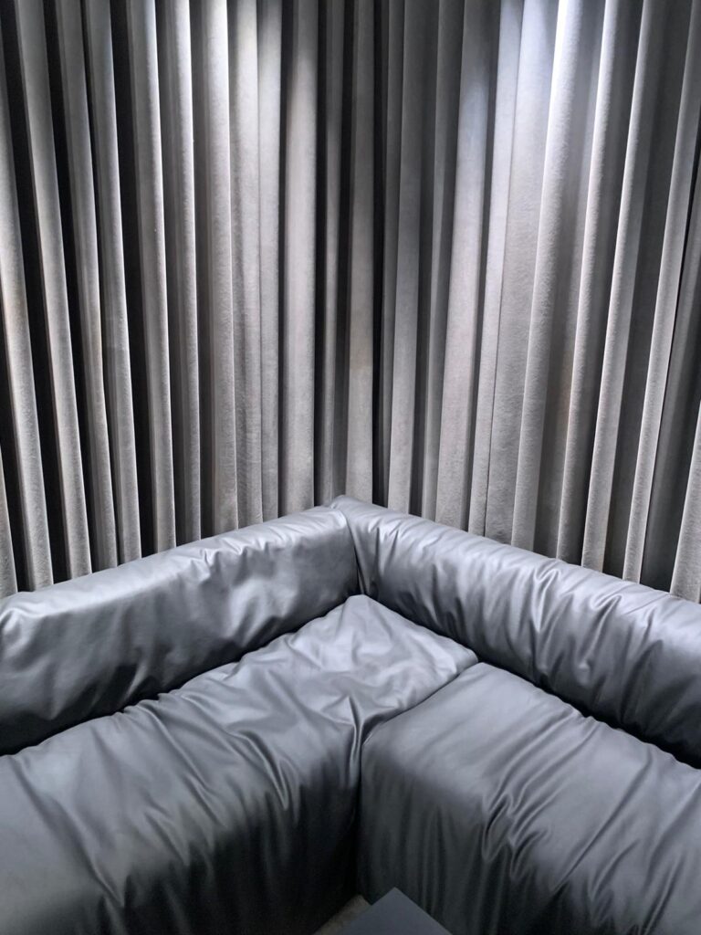 Textured walls of VIP dresing room in Balenciaga store