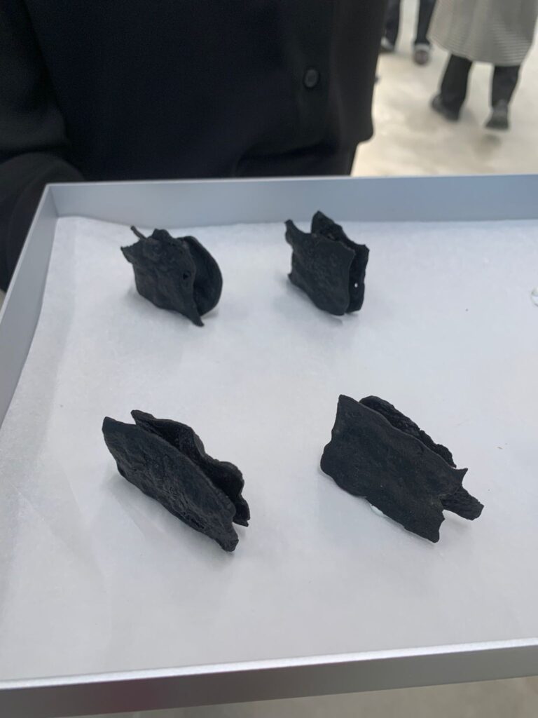 Black, brittle canapés at Balenciaga store